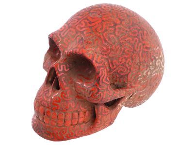 VINTAGE STONE CARVED HAND PAINTED SKULL FIGURINE. A vintage stone carved and hand painted human 