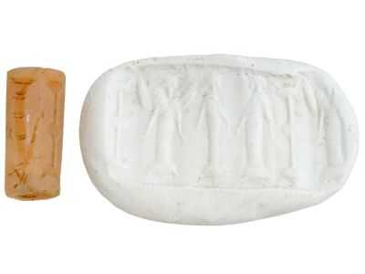 ANCIENT MESOPOTAMIAN CARNELIAN CYLINDER SEAL BEAD. An ancient Mesopotamian hand-carved carnelian 