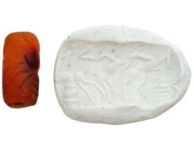 ANCIENT MESOPOTAMIAN CARNELIAN CYLINDER SEAL BEAD. An ancient Mesopotamian hand-carved carnelian 