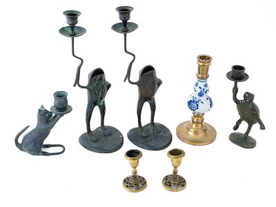 VARIOUS BRONZE AND BRASS CANDLESTICK HOLDERS. A collection of various bronze and brass 