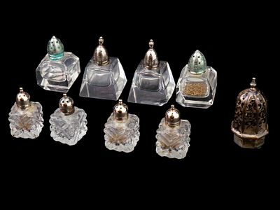 9 VINTAGE GLASS AND STERLING SILVER SALT SHAKERS. A group of 9 vintage salt shakers made of 