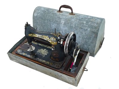 MID CENT SURJIT SEWING MACHINE WITH CARRYING CASE. A mid-20th cenutry sewing machine by Surjit 