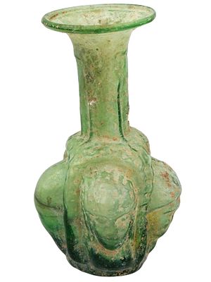 ANCIENT ROMAN GLASS VASE WITH RELIEF FACE IMAGES. An ancient Roman glass vase dating from 100 to 