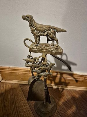 Antique Brass Fireplace Companion Set with Setter Dog Finial. Lot Description 
A charming and 