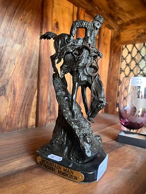 A 20th century Frederic Remington bronze sculpture titled Mountain Man