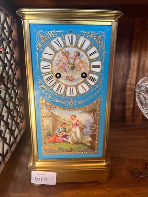 A Victorian French bracket or mantel striking clock, having hand decorated porcelain panels 