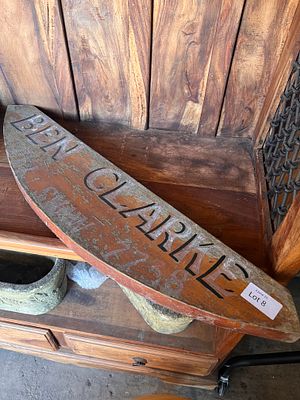 An early 20th century hand painted sign for Ben Clarke