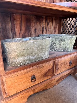 Two matching composite garden planters.