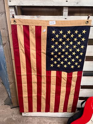 A hand-sewn American flag of stars and stripes.