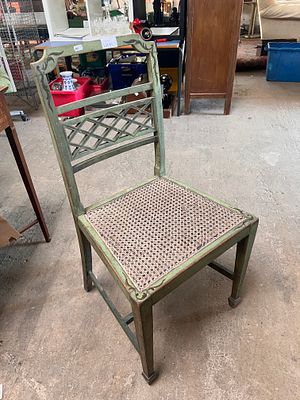 An early 20th-century French shabby chic painted bedroom chair.