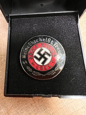 A genuine German Third Reich Adolf Hitler pin badge dated 1933.