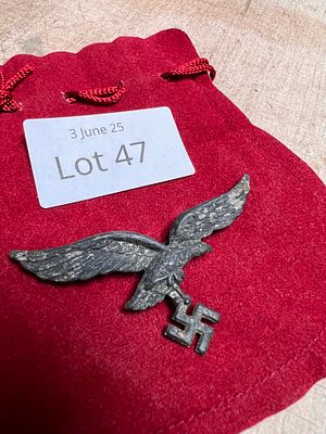 A genuine German Third Reich Luftwaffe 2nd pattern cap badge.