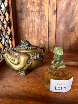 A 19th century Chinese bronze cast tea pot in the form of a toad decorated with lucky coins and 