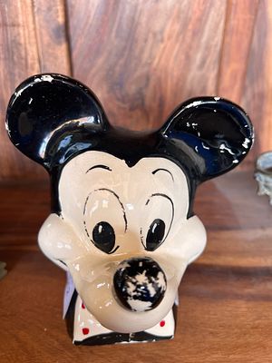 An early 20th century Mickey Mouse money bank.