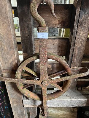 A cast iron hook and pulley.