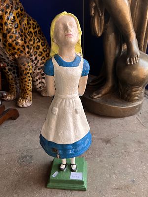A vintage cast iron garden statue of Alice in Wonderland 59cm tall