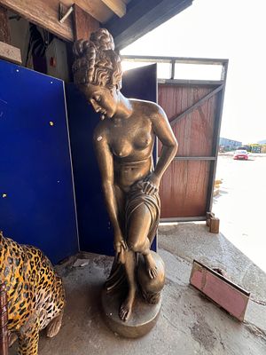 A life size reconstituted stone statue of a classical maiden. 165cm tall