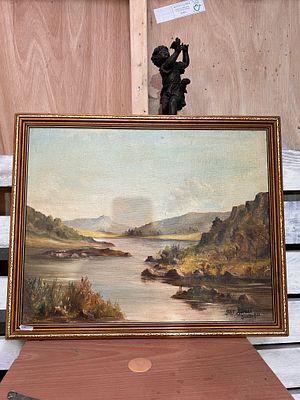 A vintage oil on board of a landscape.