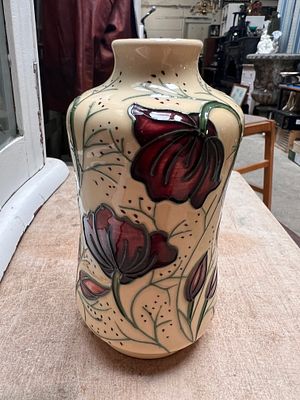 A Moorcroft Chocolate Cosmos pattern vase 14cm tall. Signed to base.