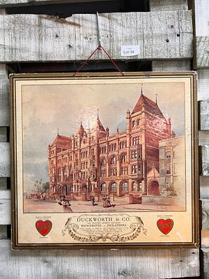 An antique double sided card advertising sign for Duckworth Manchester.