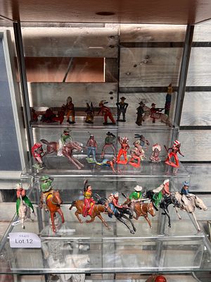 A selection of early 20th-century lead toy cowboys and indians.