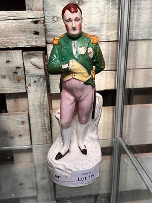 A Victorian Staffordshire figure of Napoleon having had repair. 26cm tall.