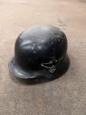 A WW2 or similar German helmet.