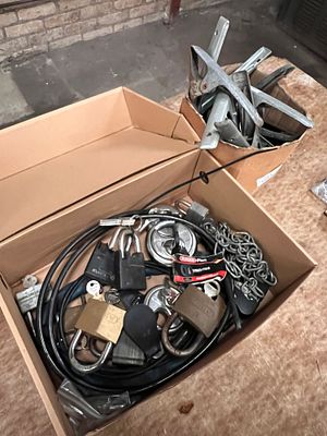 A selection of padlocks, chains and spring clamps.