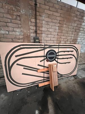 A railway layout 00 gauge on folding table.
