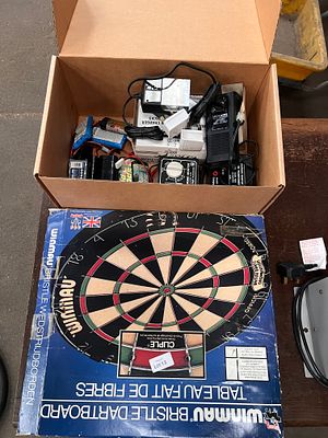 A selection of RC remote control and Ni-cad batteries, with dart board.