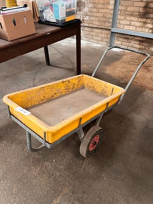 A yellow single axle tote truck.