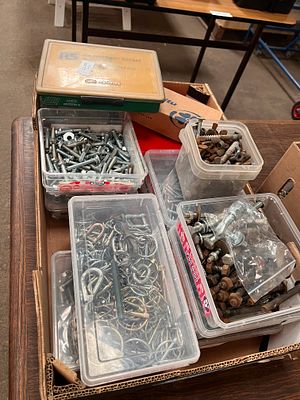 A large box of nuts, bolts and various hardware.