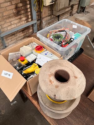 A box of electrical equipment, switches, plugs, sockets, connectors etc + 2x drums of cable