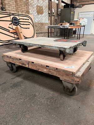 Two industrial workshop trolleys on castors.