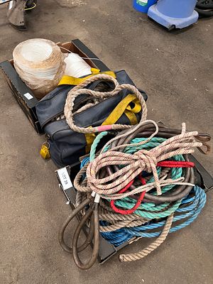 A crate of various ropes and packing string