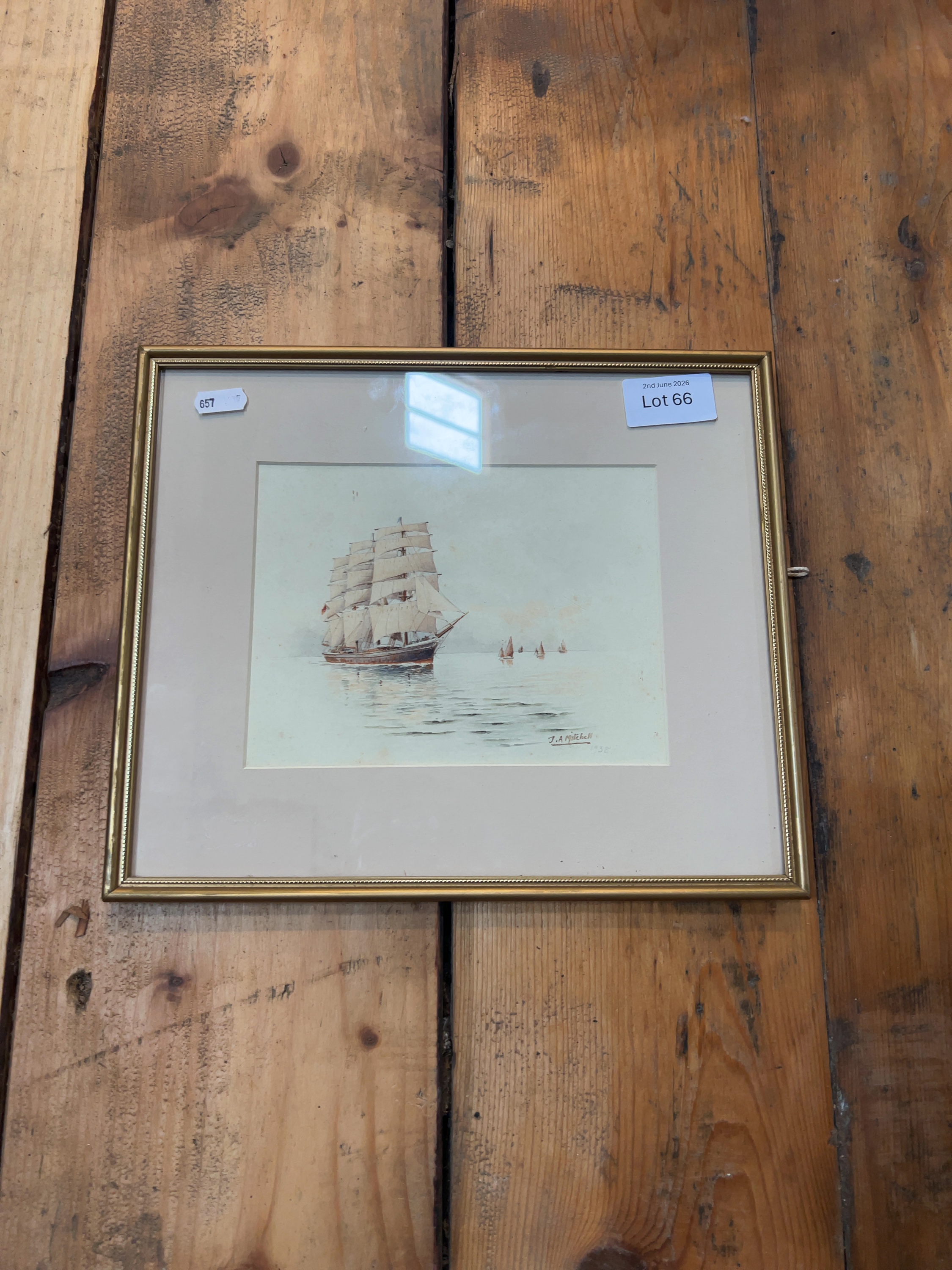 J.A Mitchell (20th Century), A Three-Masted Barque and Coastal Craft, watercolour, dated 1938