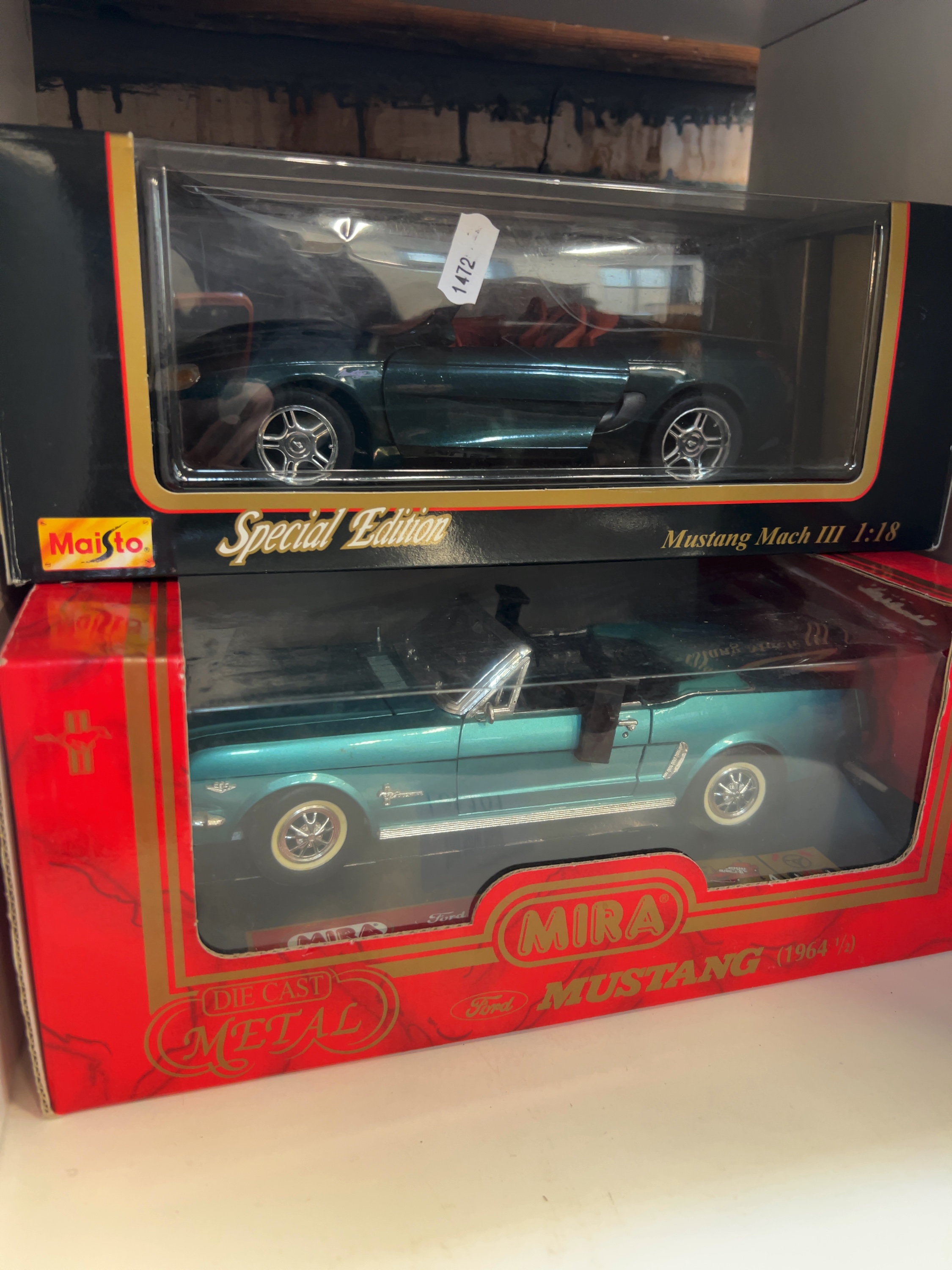 A Pair of 1:18 Scale Ford Mustang Model Cars by Maisto and Mira