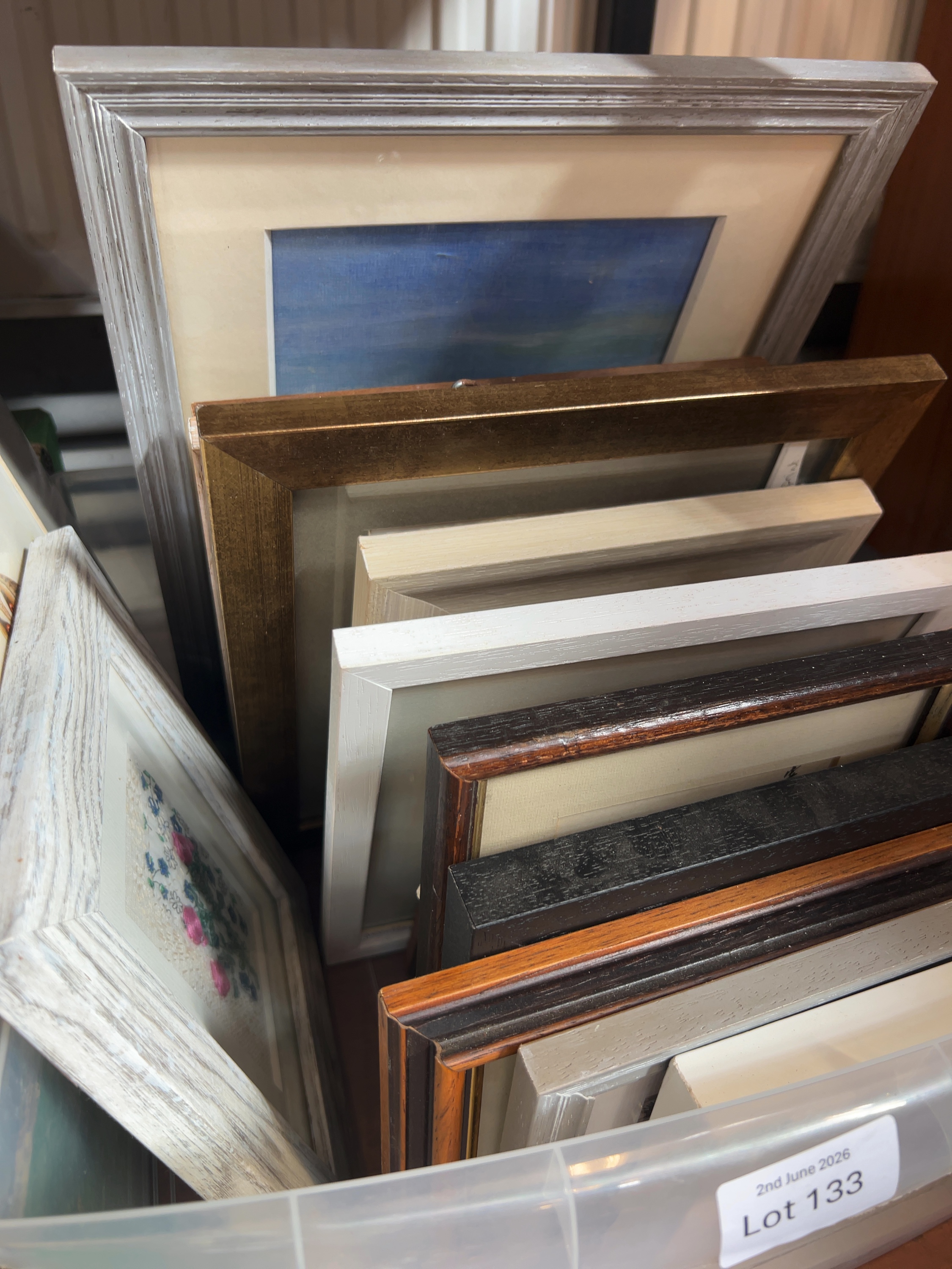 A Collection of Framed Artworks and Assorted Picture Frames