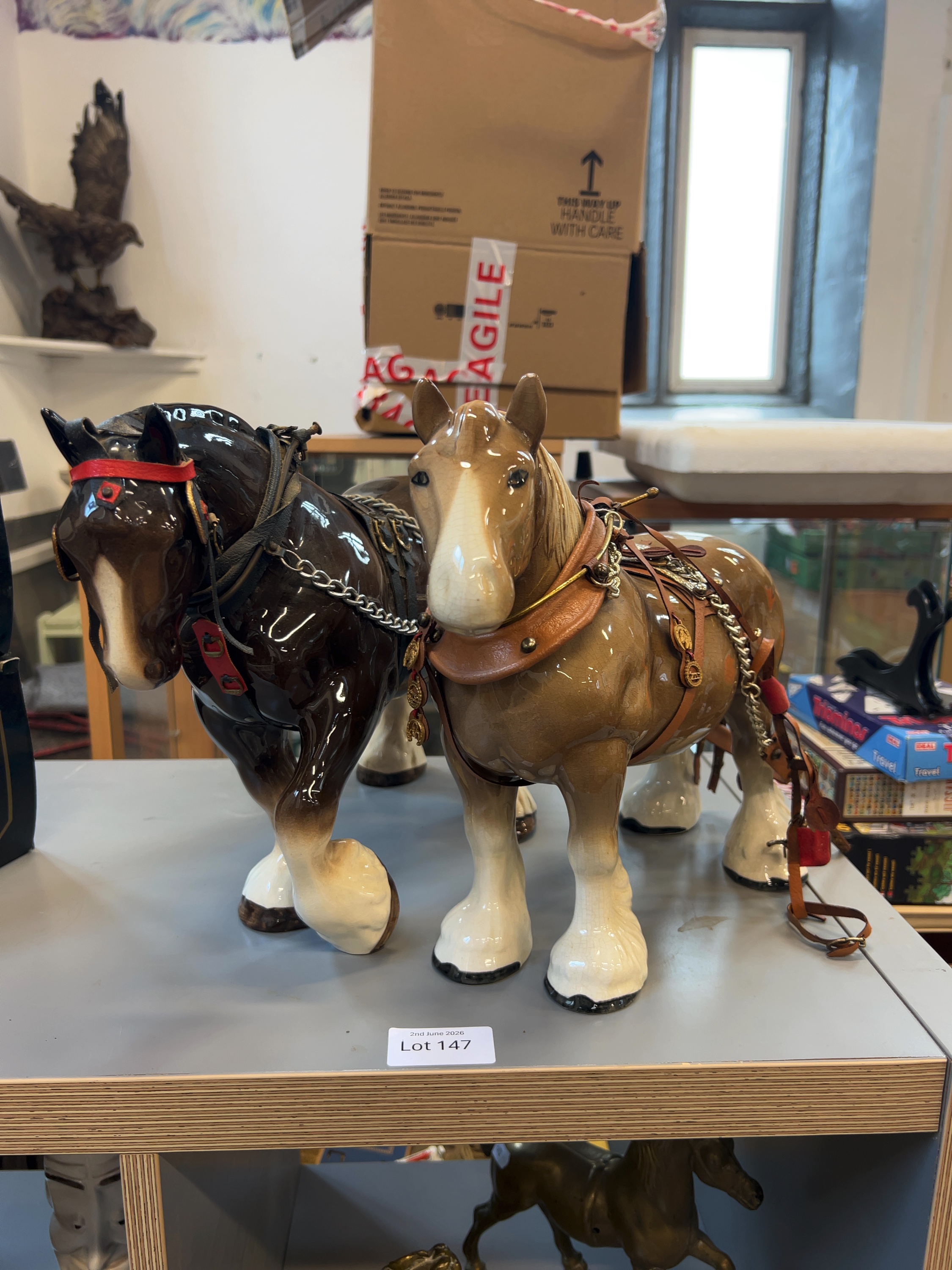 A Pair of Large Glazed Ceramic Shire Horse Figurines with Traditional Show Harnesses