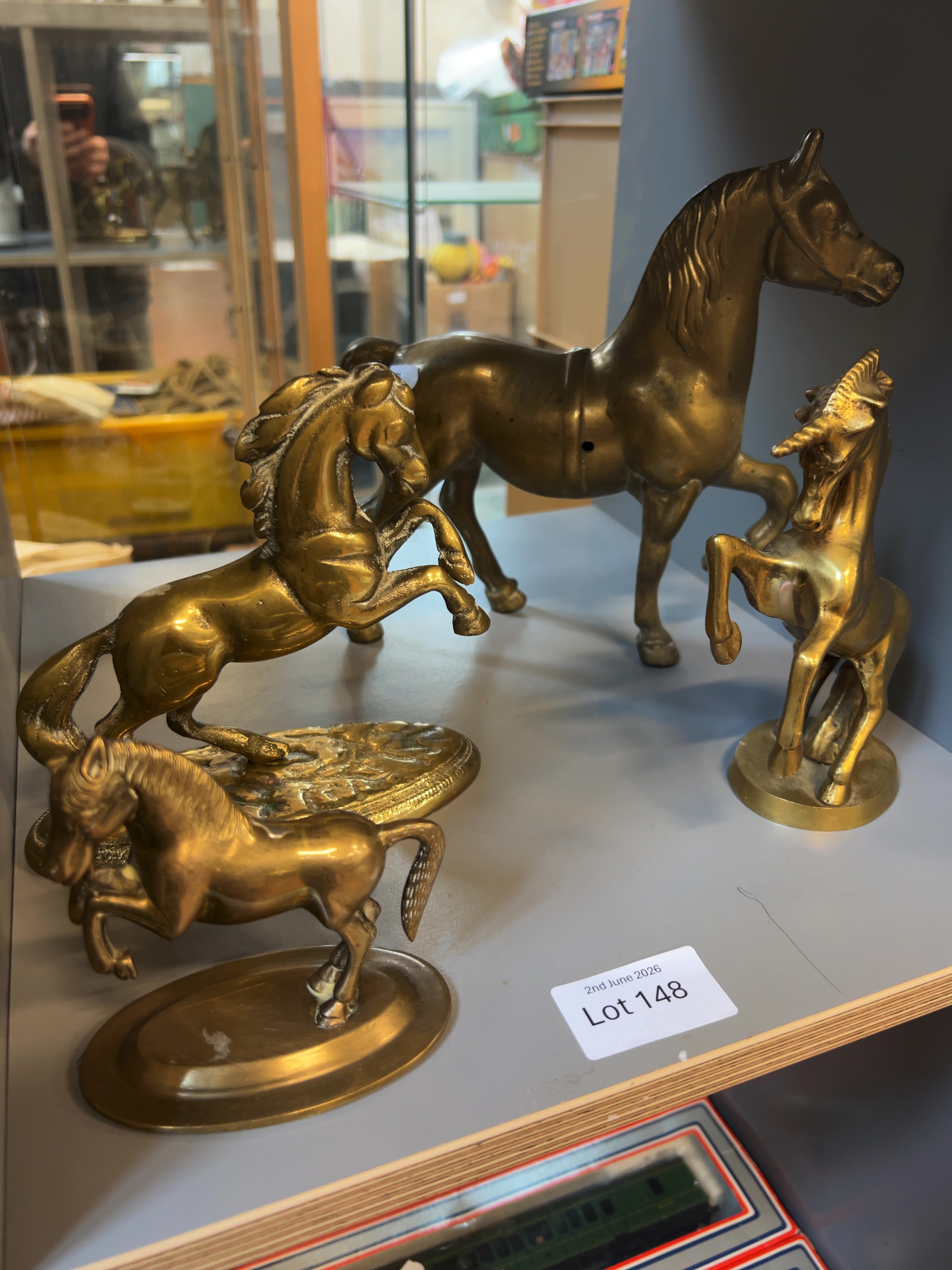A Collection of Four Vintage Cast Brass Horse and Unicorn Figurines