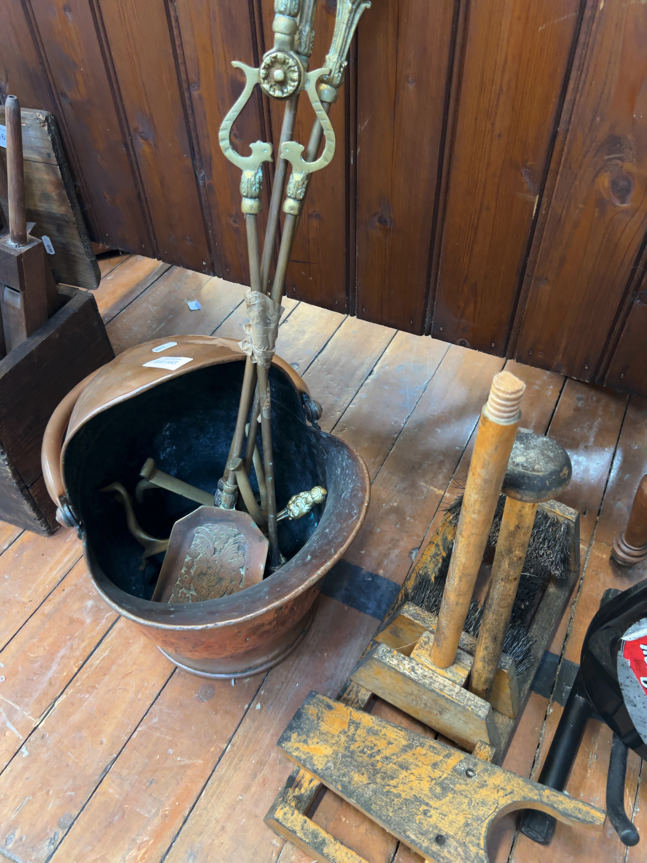 A Trio of Domestic Metalware and Utility Items Comprising a Copper Coal Scuttle, Brass Fire Tools, and a Wooden Boot Scraper