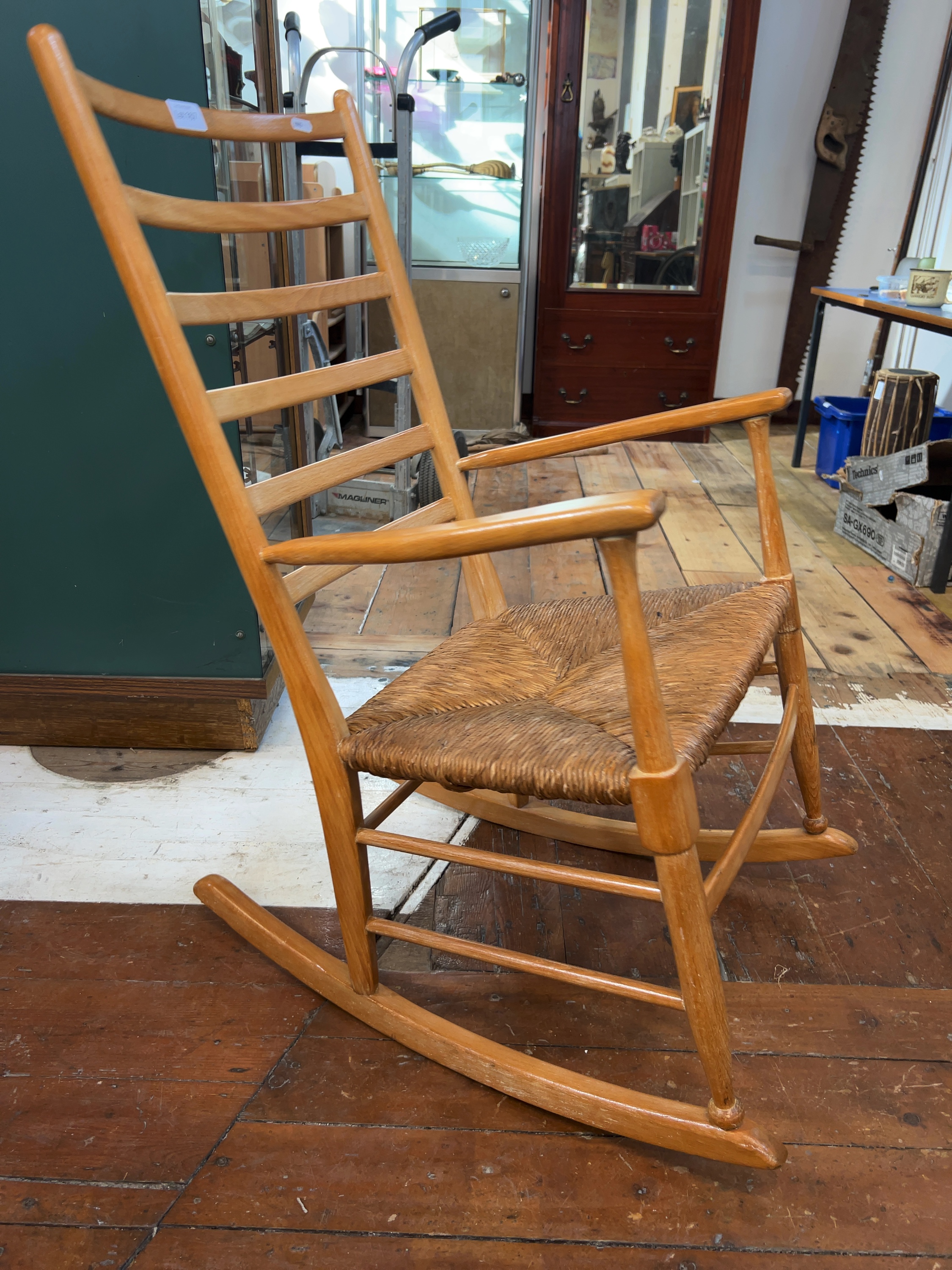 A Mid-Century Modern Ladder-Back Rocking Chair in the Manner of Hans J. Wegner