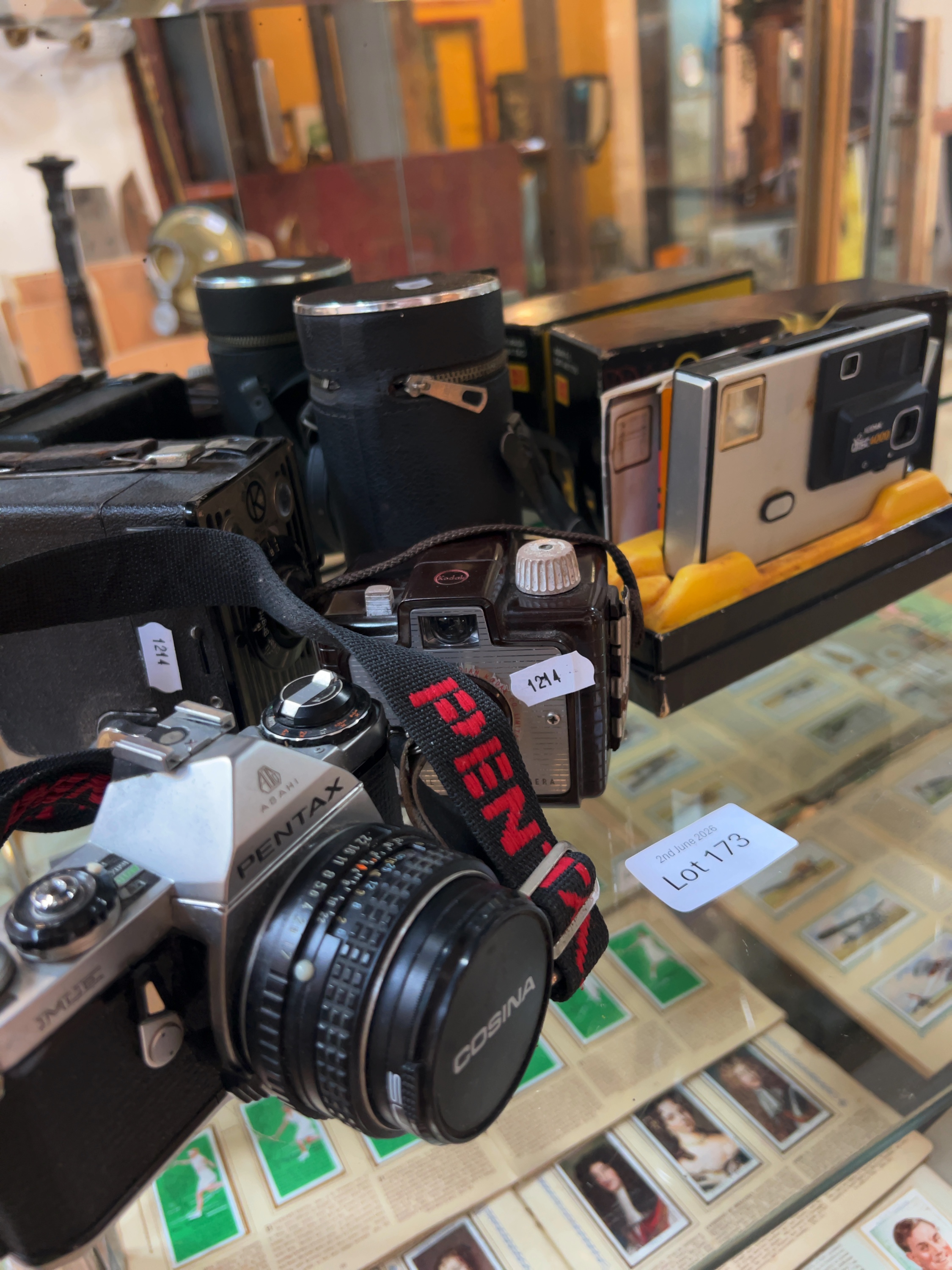 A Collection of Vintage Cameras and Accessories Including Pentax and Kodak Models