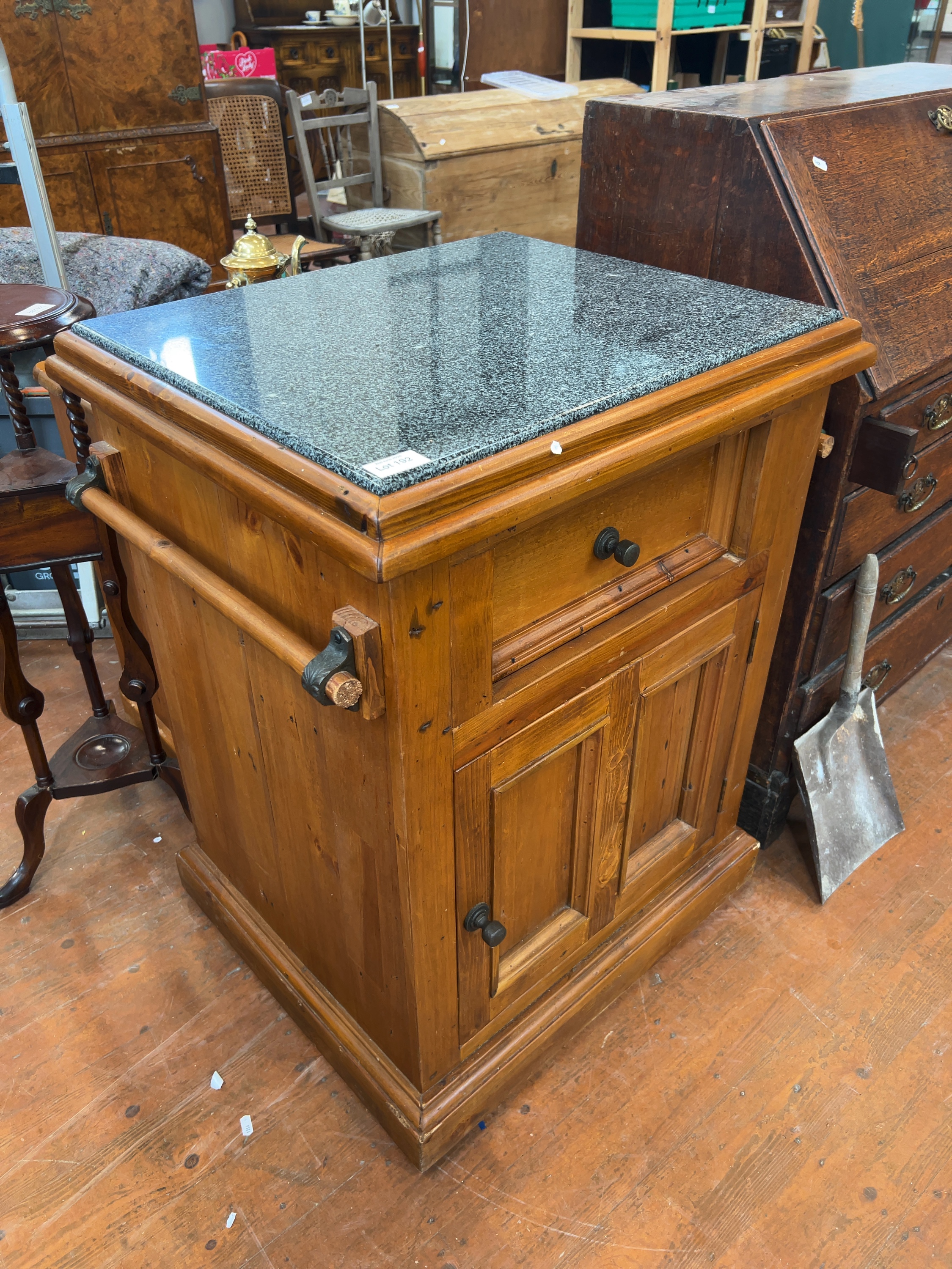 A modern pine kitchen workstation with granite inset top