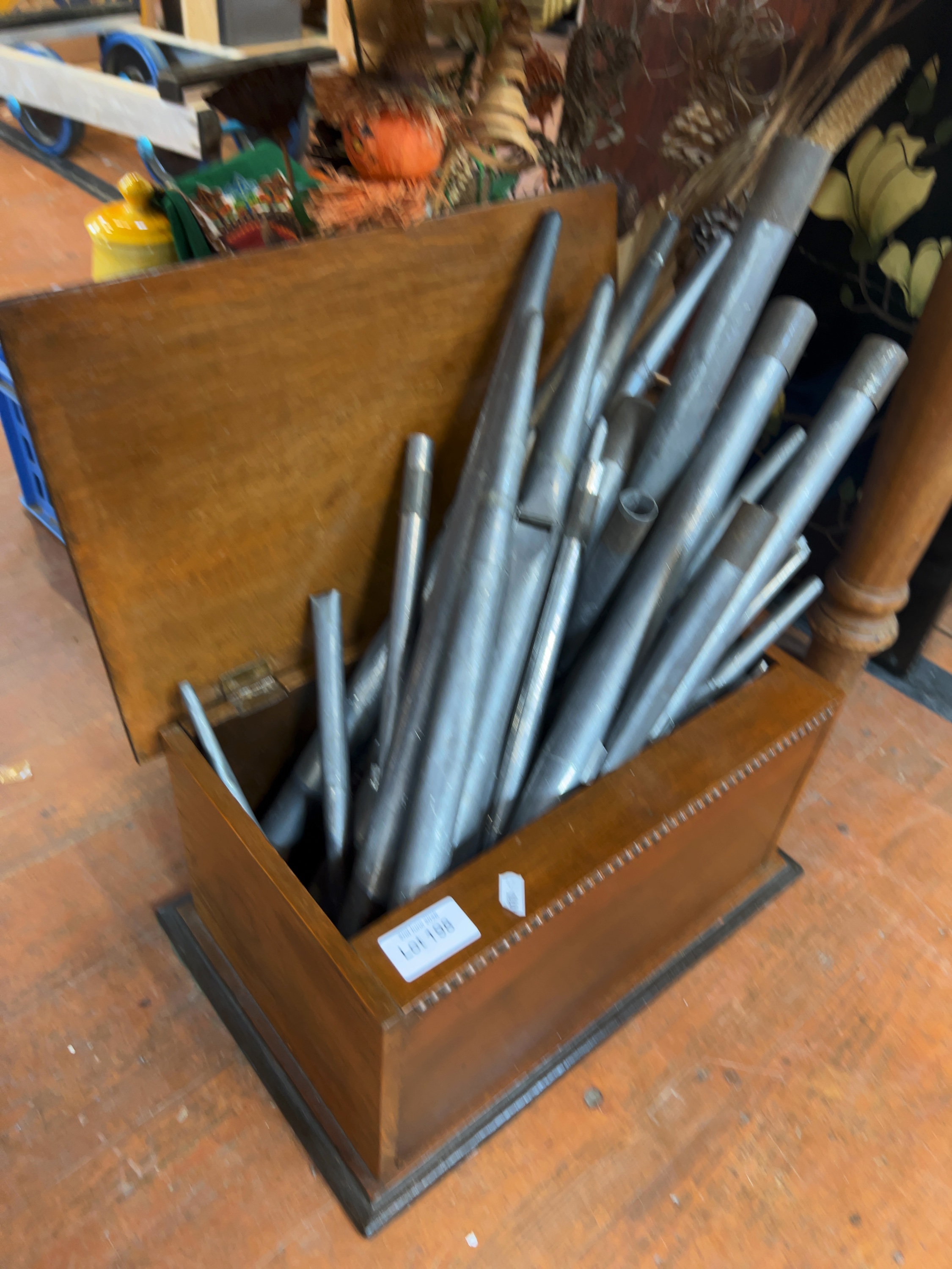 A Collection of Metal Organ Pipes in a Stained Hardwood Fitted Chest