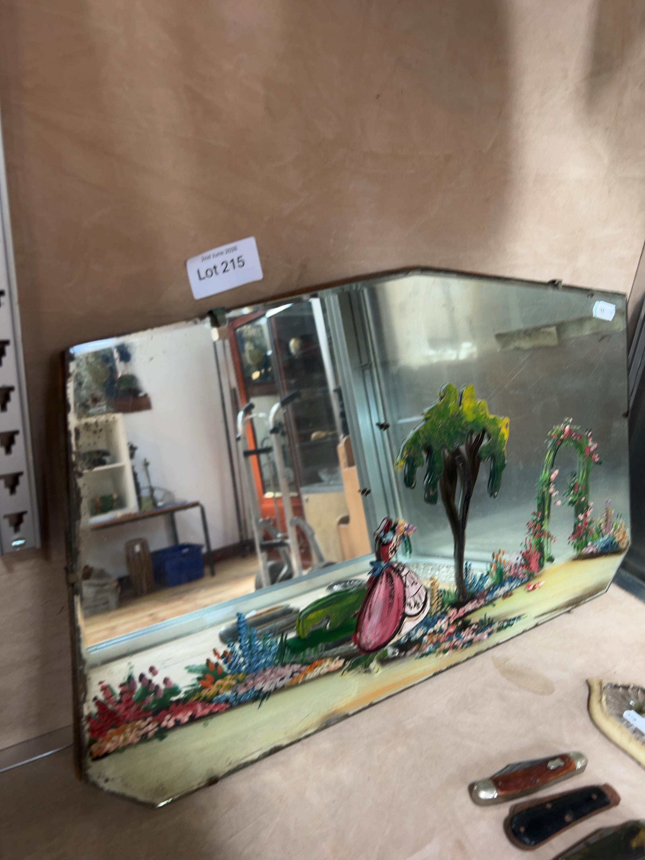 An Art Deco period frameless wall mirror with hand-painted Crinoline Lady decoration