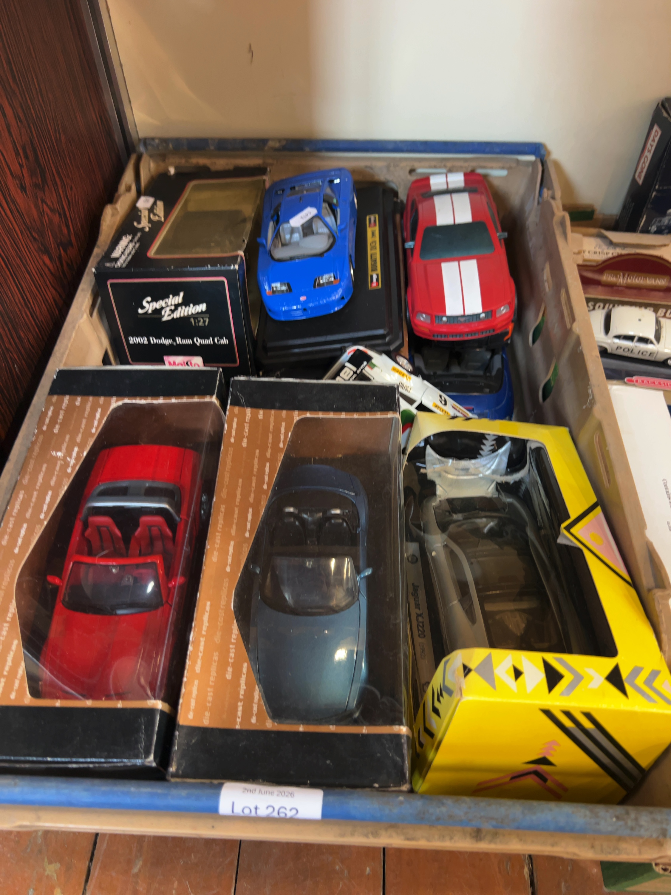 A Collection of Large Scale Model Vehicles Including Mondo Motors, Maisto and Others