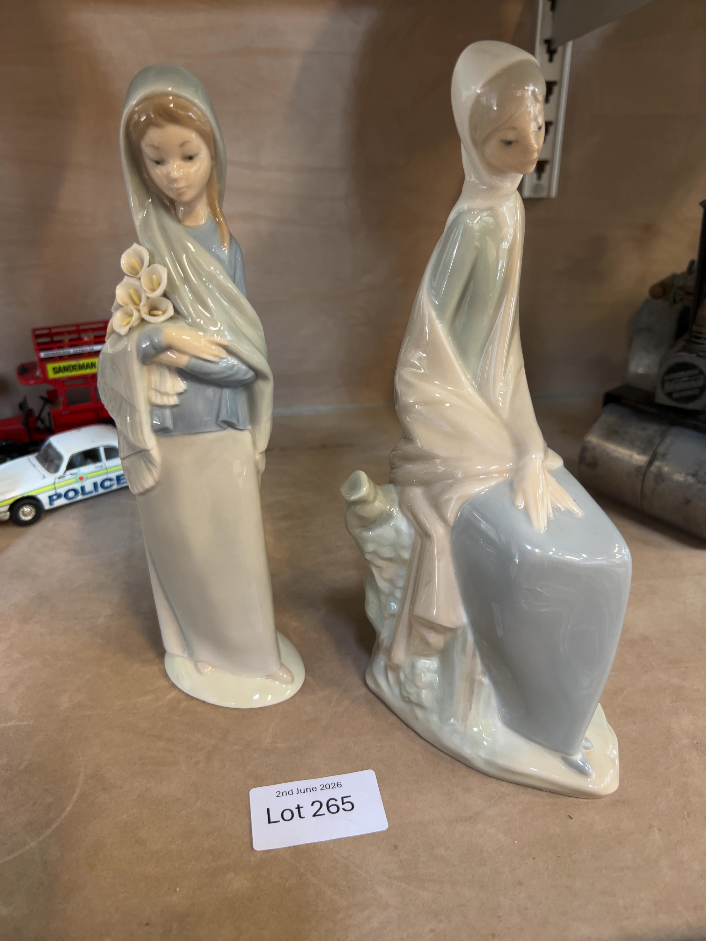 Two Spanish porcelain figurines by Lladro and NAO