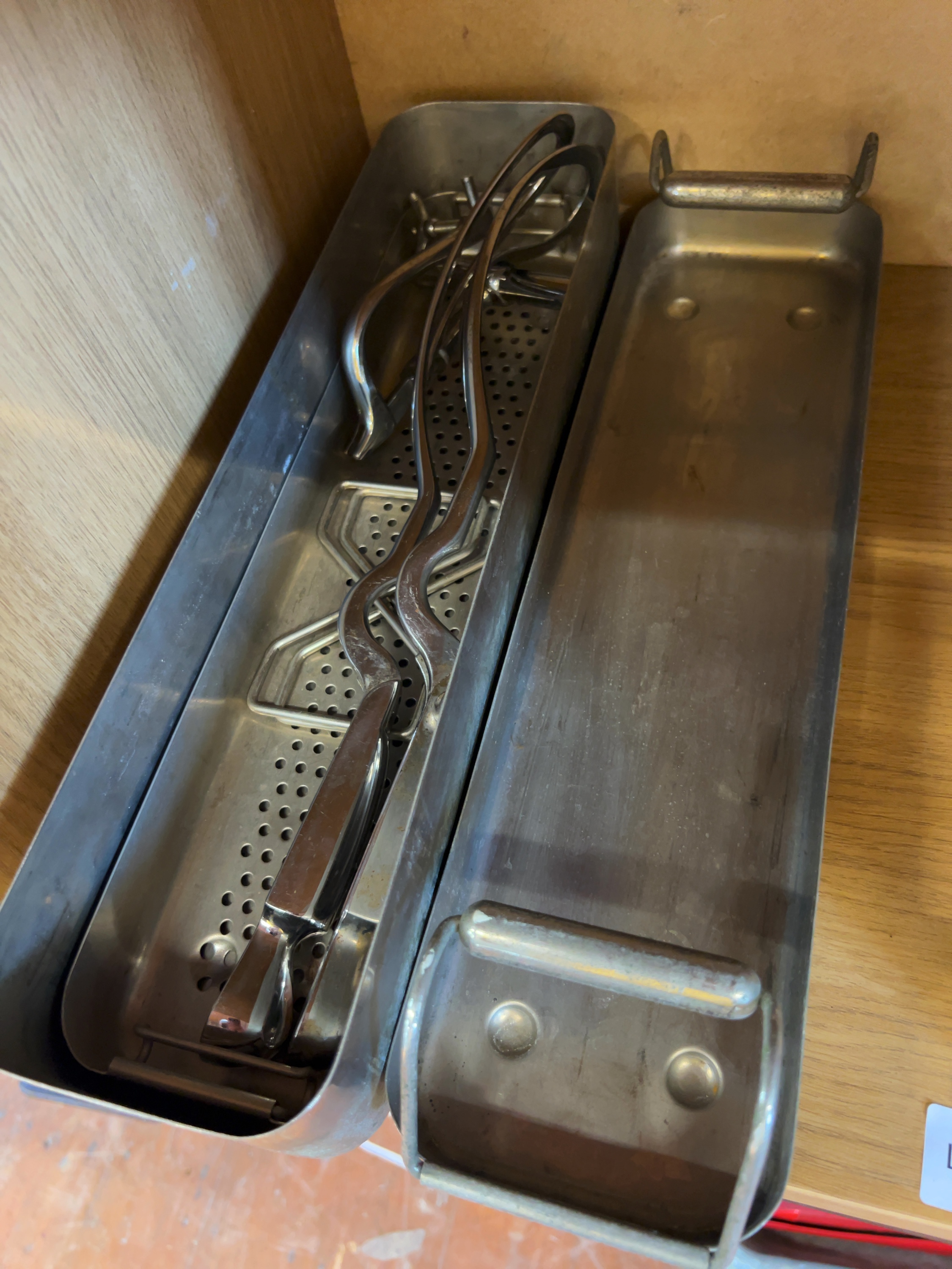 A Stainless Steel box Containing a Selection of Surgical Instruments