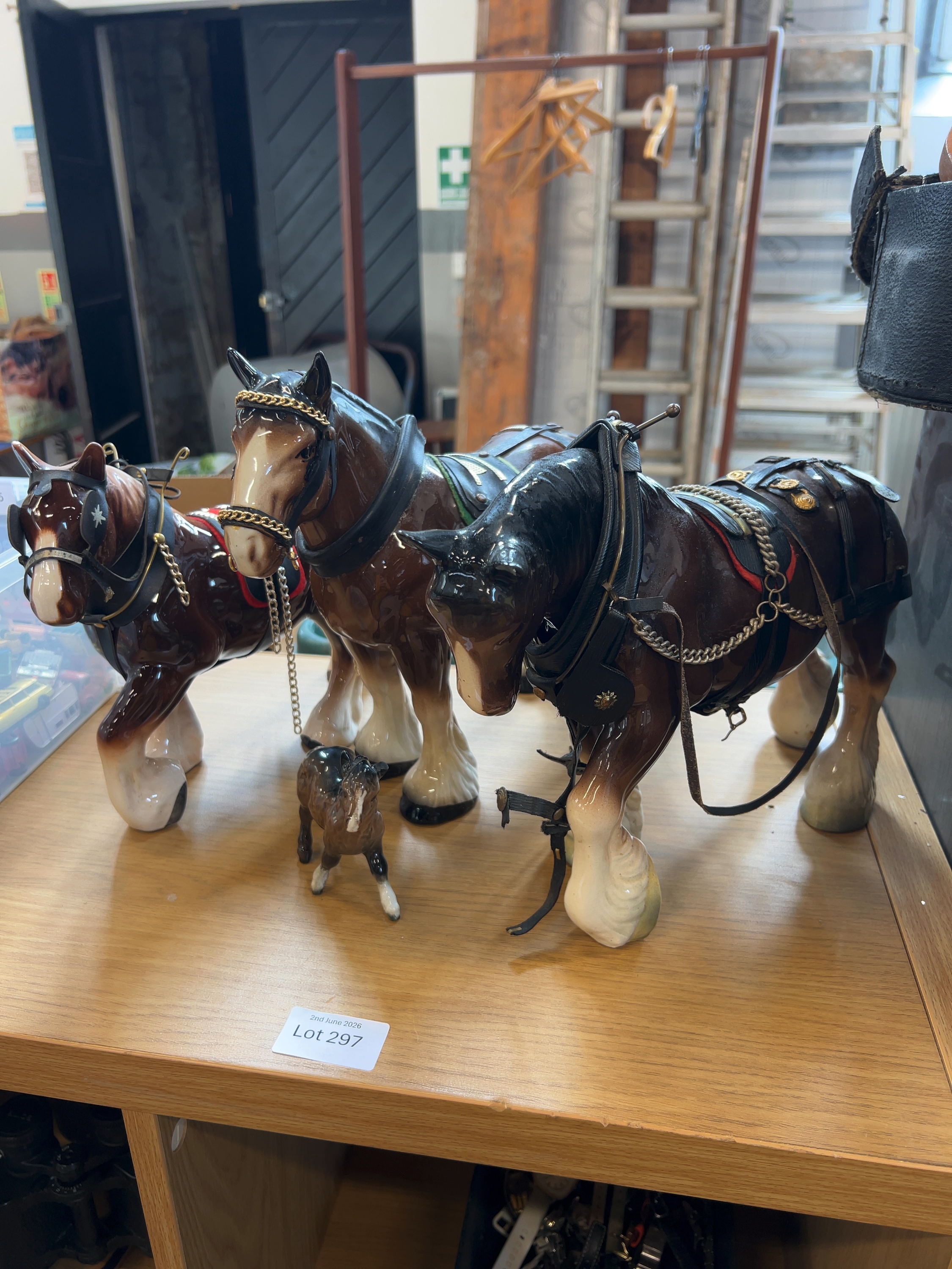 A Collection of Ceramic Shire Horse Figurines in Harness